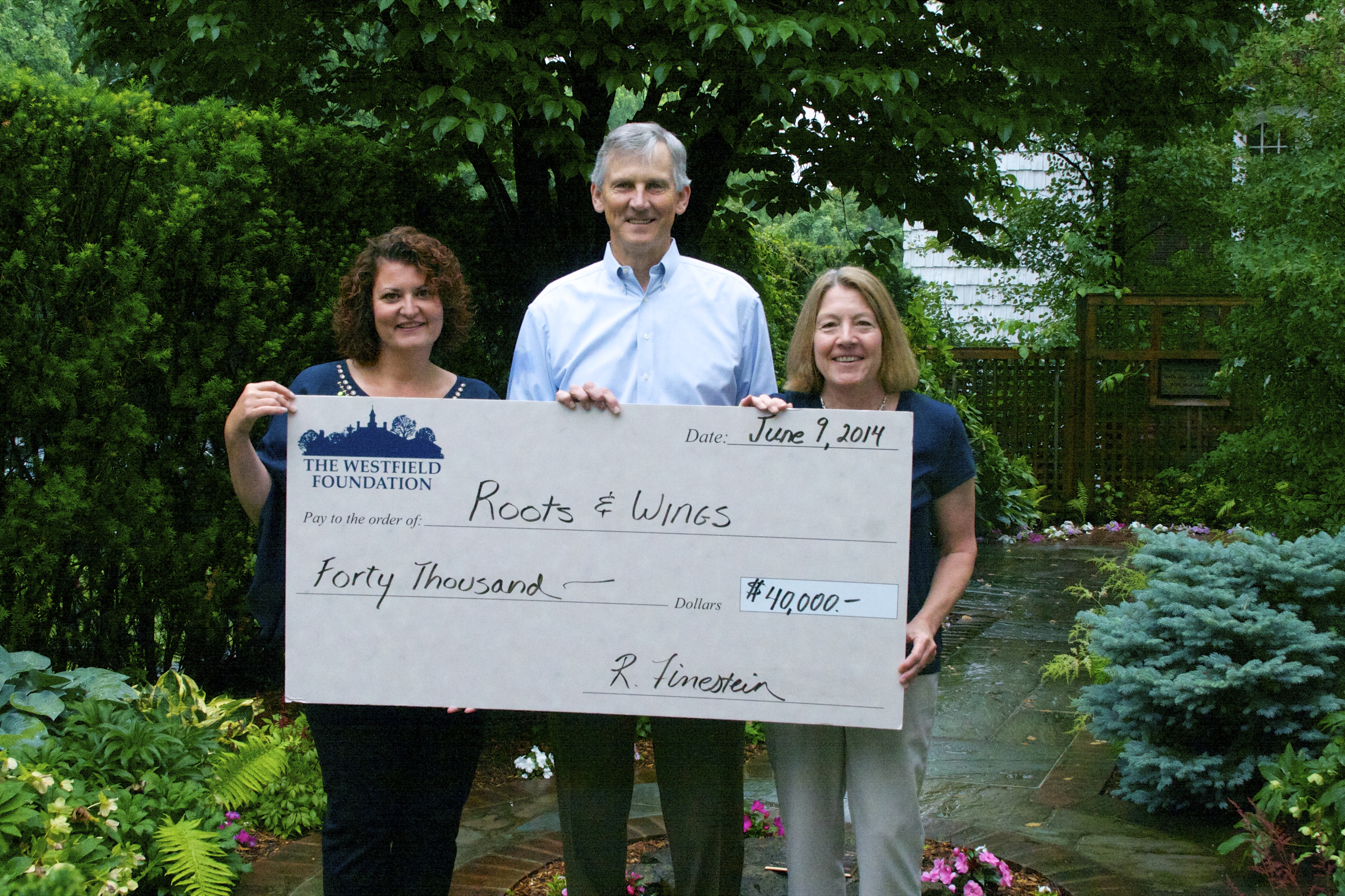 The Westfield Foundation presents representatives from Roots & Wings a ‘check’ for $40,000.  Pictured (l to r): Kim Spangenberg, Executive Director of Roots & Wings, Joe Masterson, Union County Leadership Council member and R&W spokesman and Elizabeth Chance, Executive Director of the Westfield Foundation. 